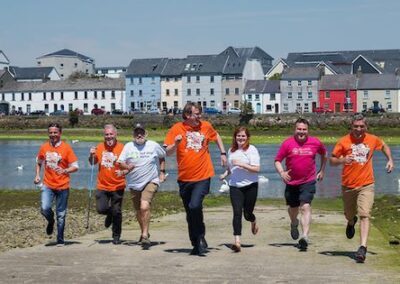 Ronan Scully pictured with the Mayor Neil McNeilis and participants of his Bay to Bay 300km walk 2018. 400x284 1